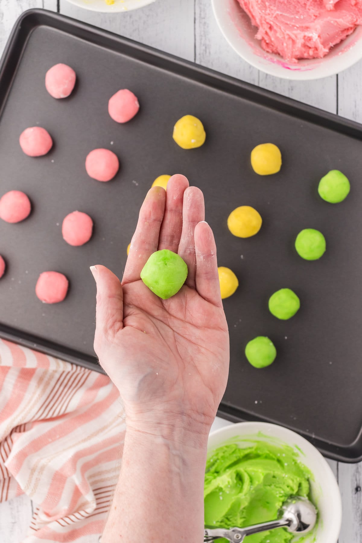 Rolling the dough into small balls.