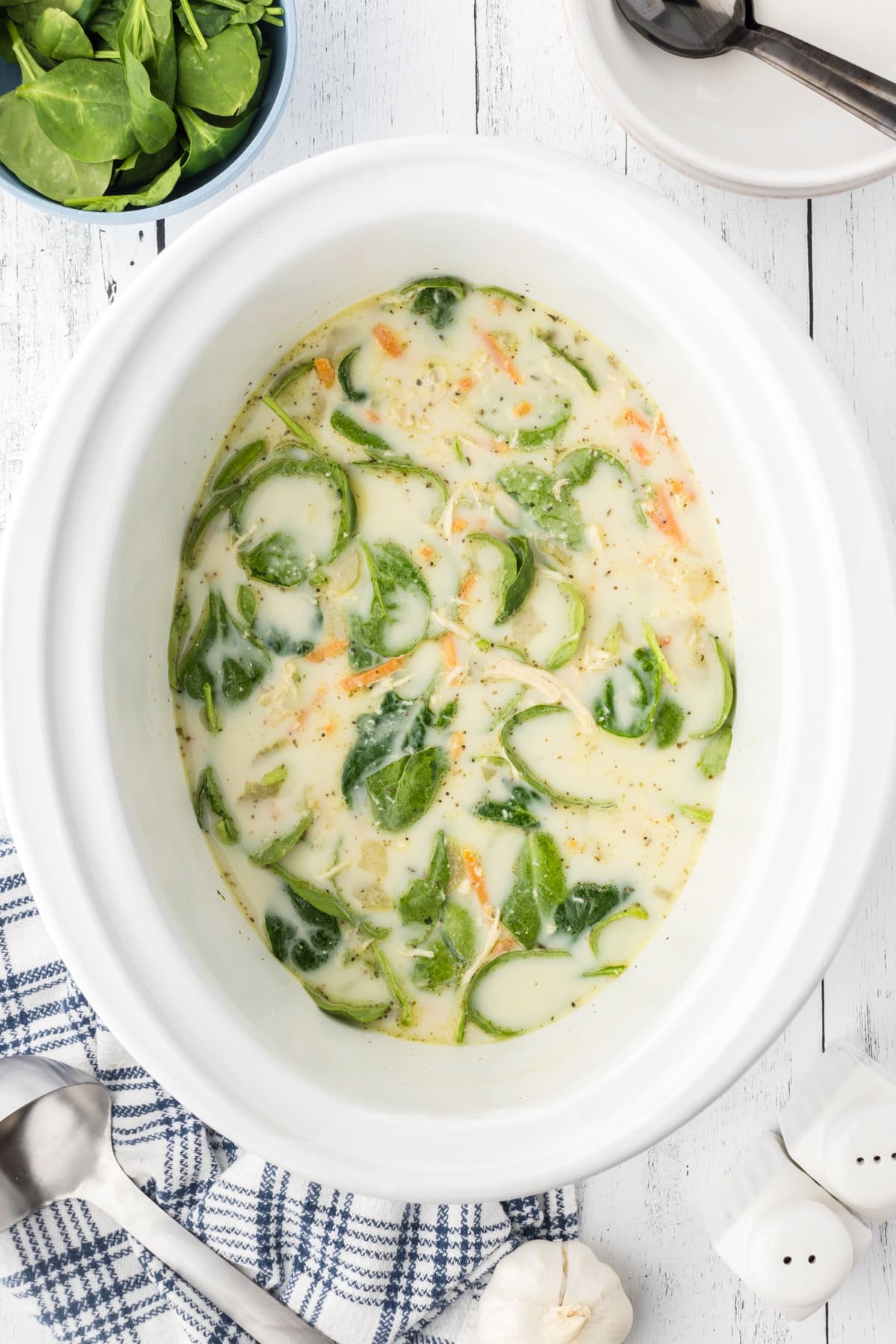 Spinach stirred into the gnocchi soup.