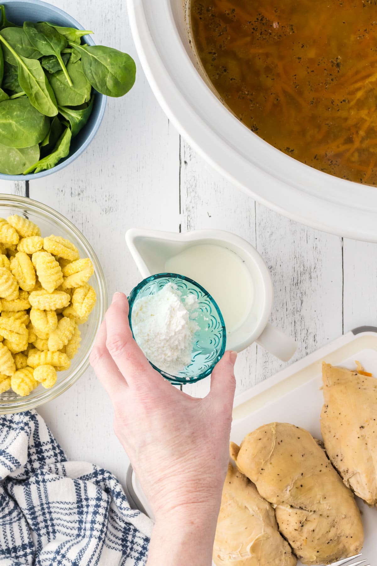 Stirring cornstarch into cream.