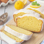 Closeup of slices of lemon loaf with a white glaze.
