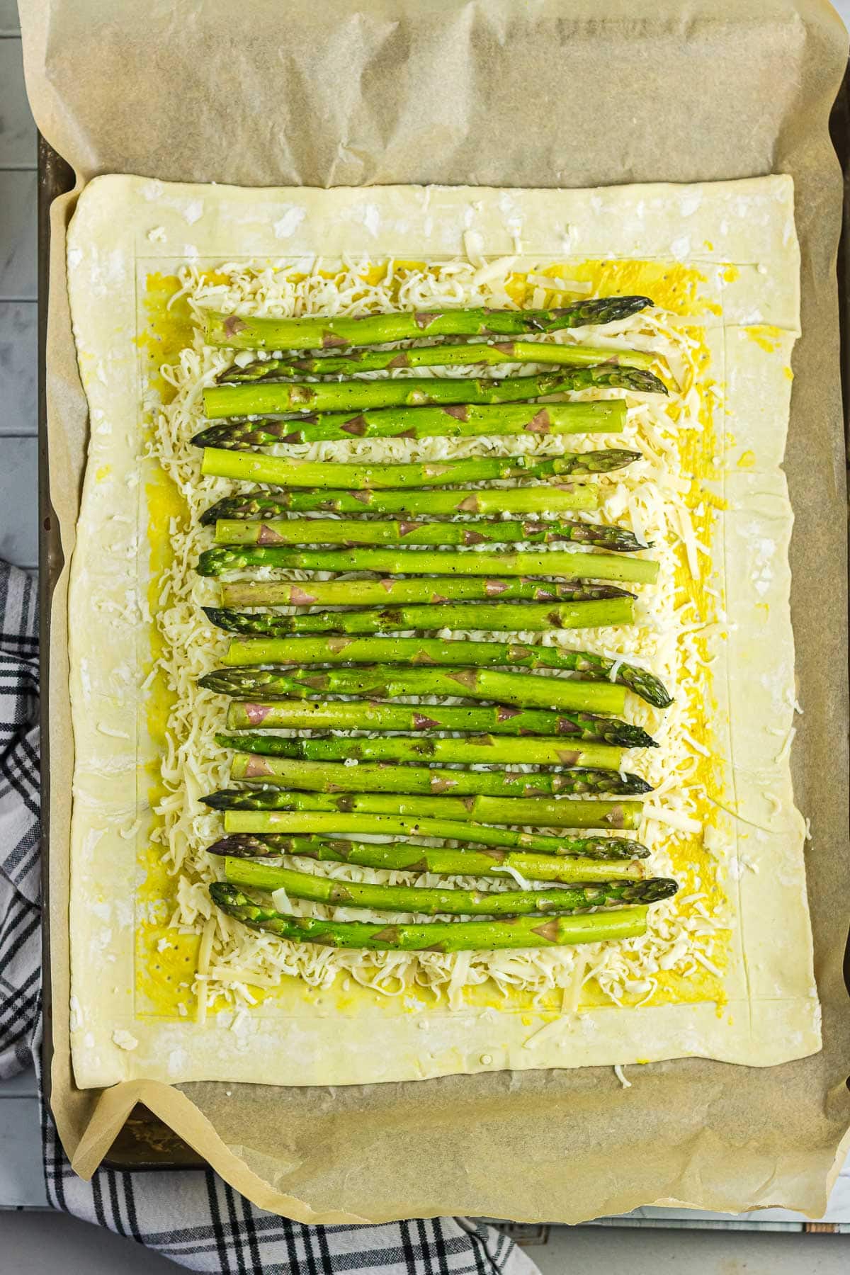 Asparagus and cheese on puff pastry.