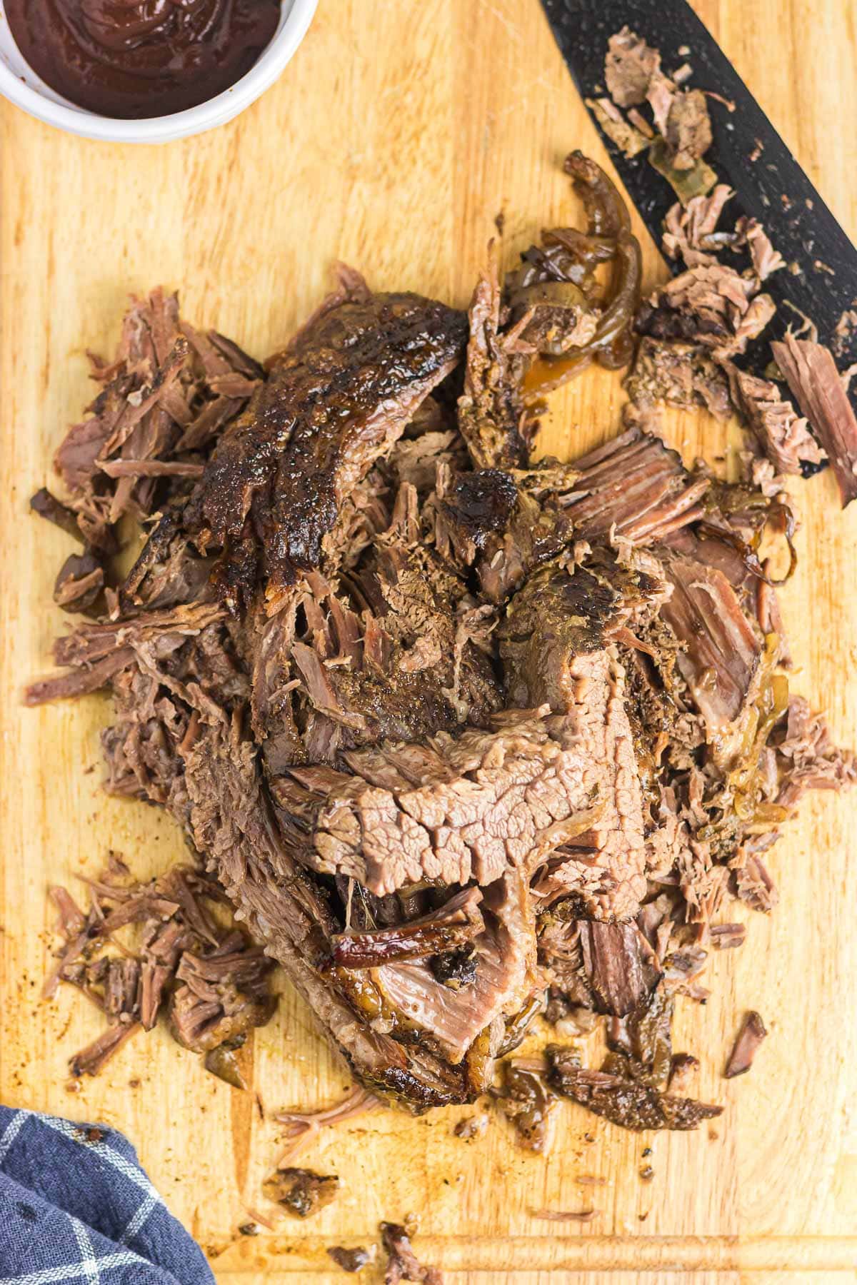 Sliced brisket on a cutting board.