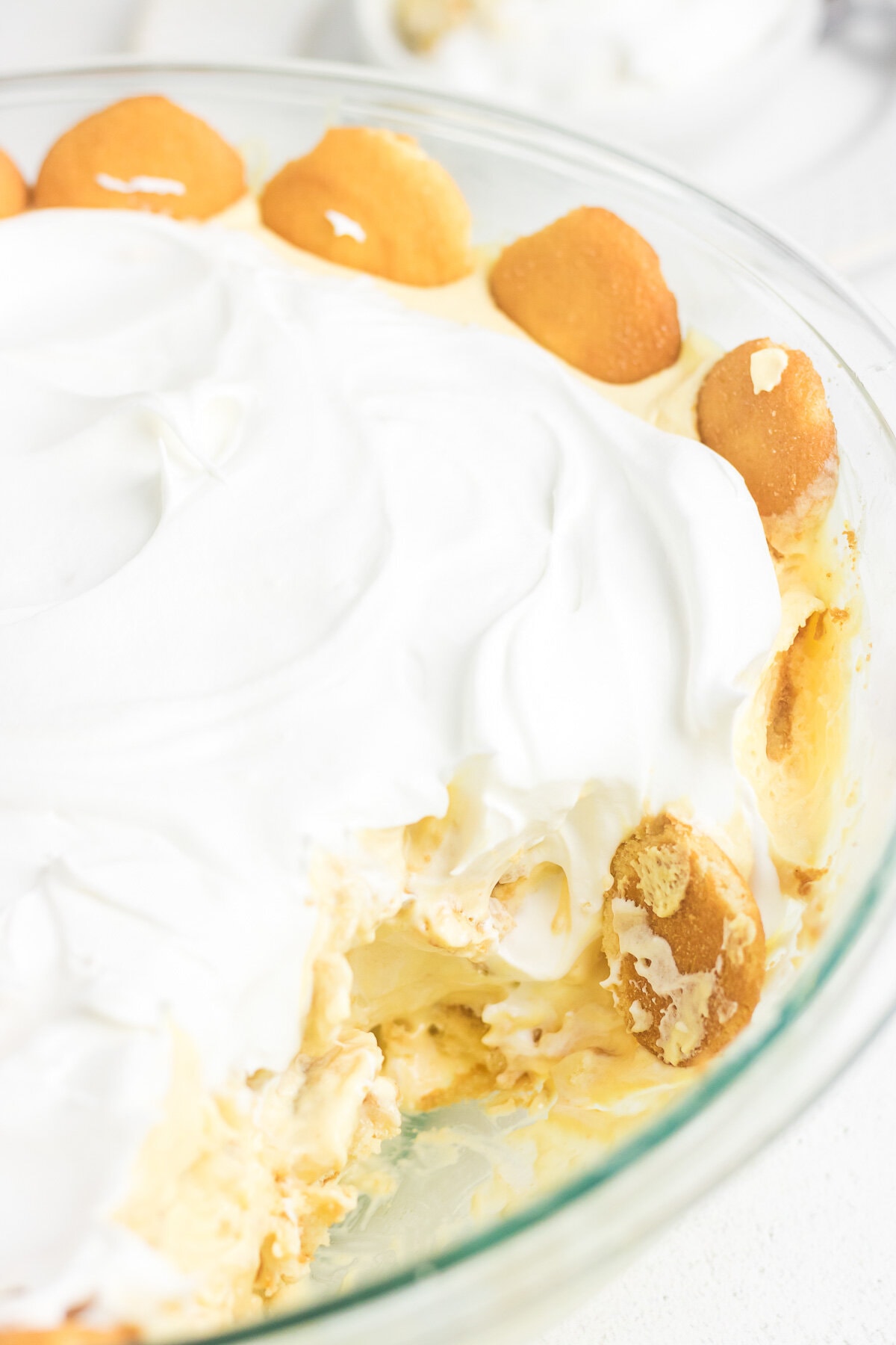 An up-close photo of banana pudding in a glass dish.
