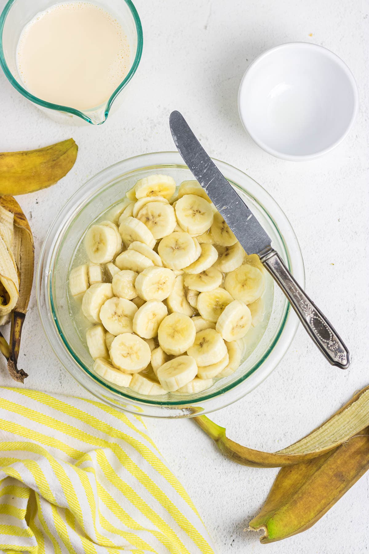 Sliced bananas in a bowl.