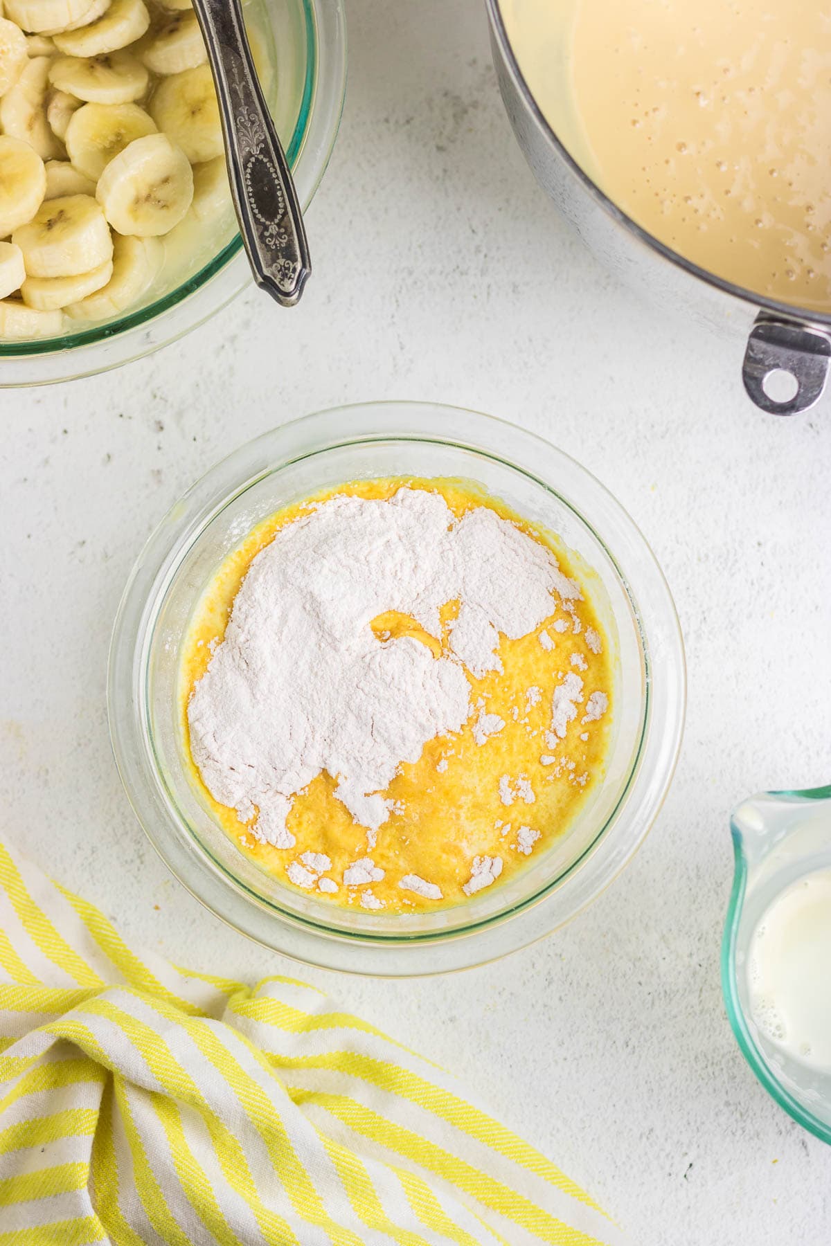 Pudding mix and evaporated milk in a mixing bowl.