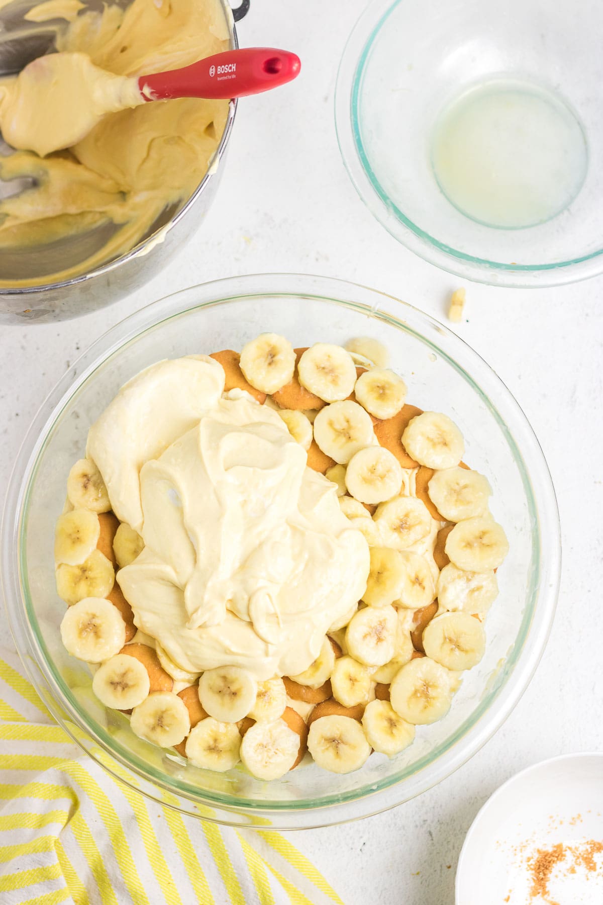 The finished banana pudding with whipped topping dolloped on top.