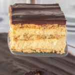 A closeup of a slice of eclair cake with a title text overlay for Pinterest.