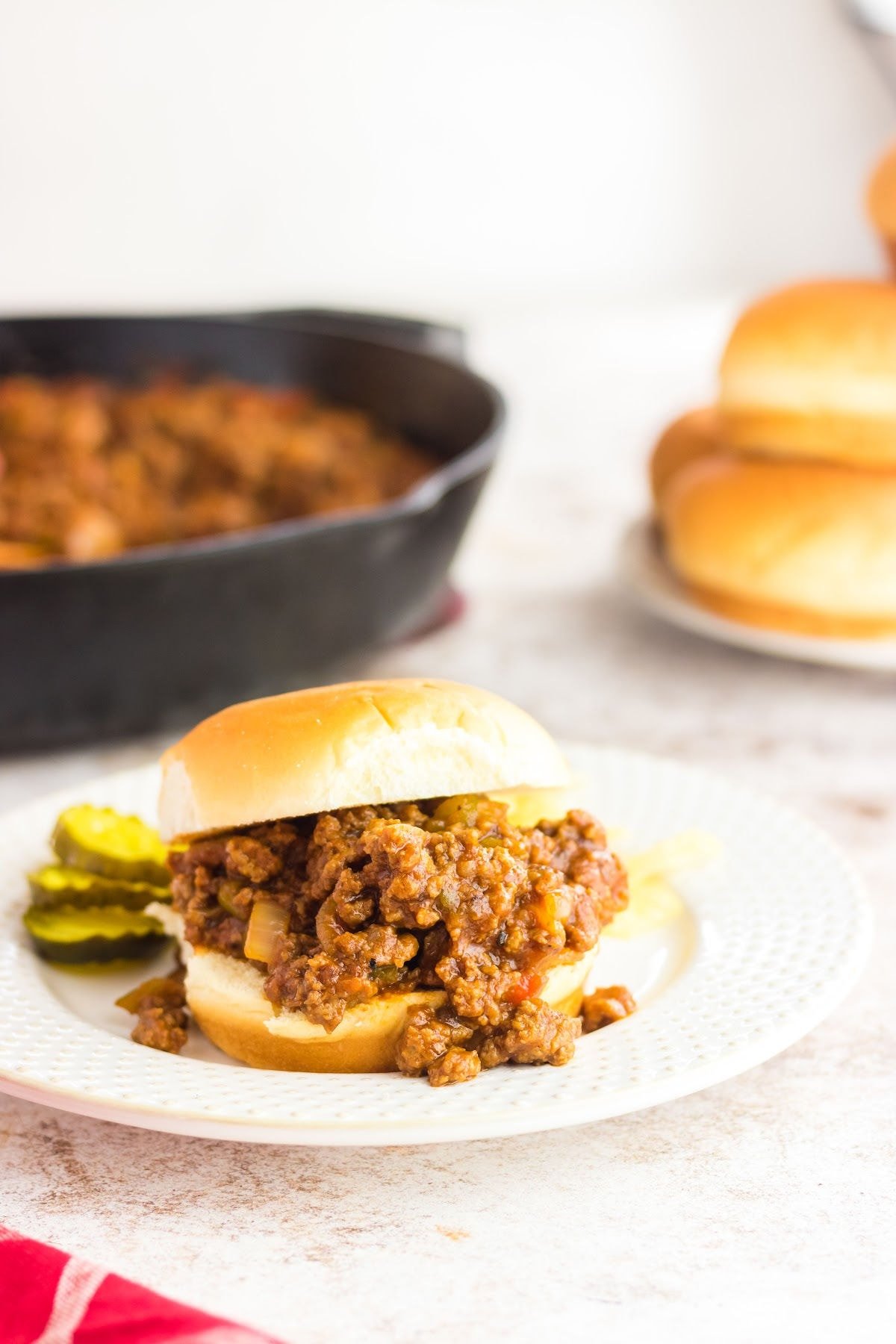 A sloppy joe sandwich on a plate.