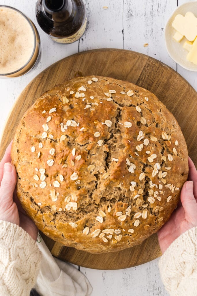 A loaf of Irish soda bread on a cutting board.