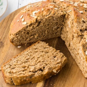 A loaf of Irish soda bread with a wedge removed.