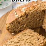 A loaf of Guinness Irish soda bread with a slice taken out and title text overlay for Pinterest.