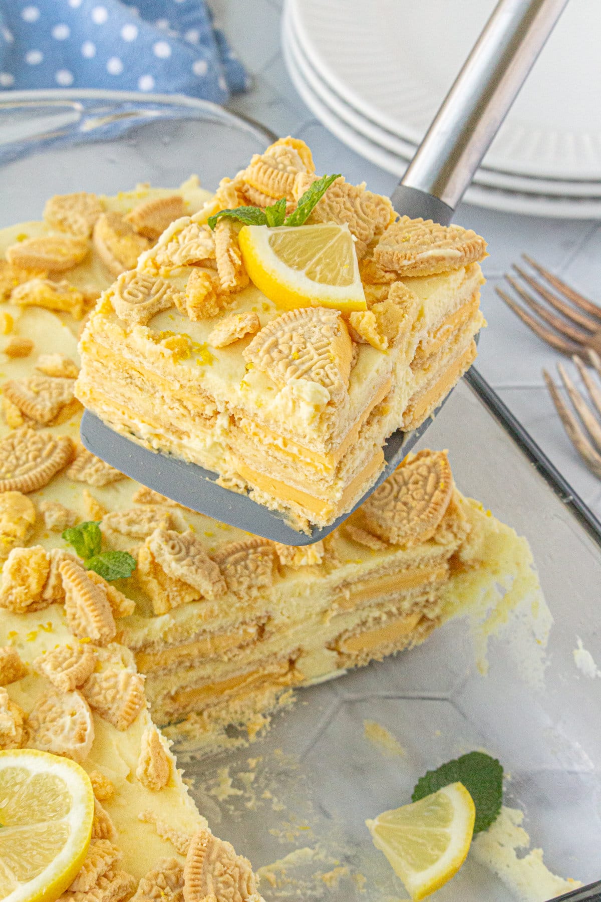 A slice of lemon icebox cake being served.