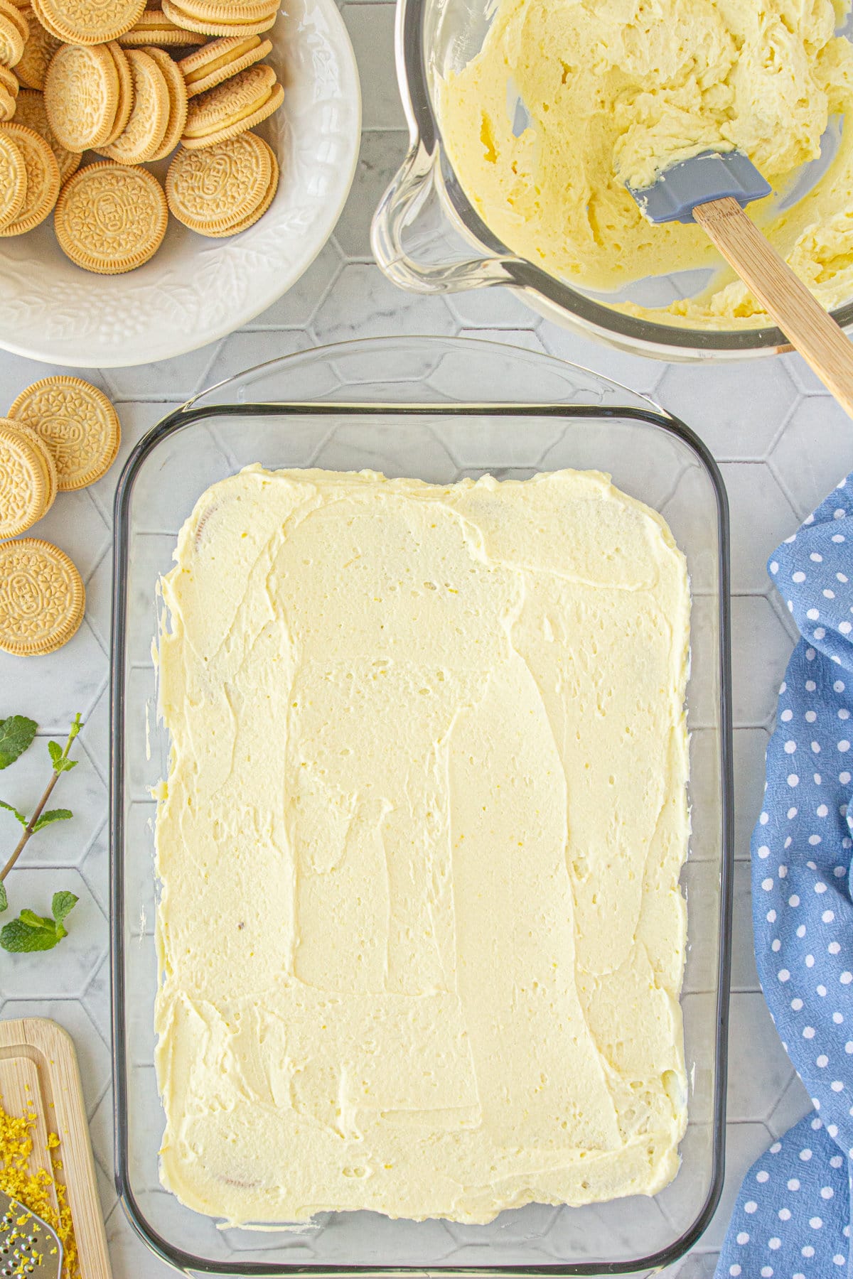 The lemon filling over the first layer of Oreos.