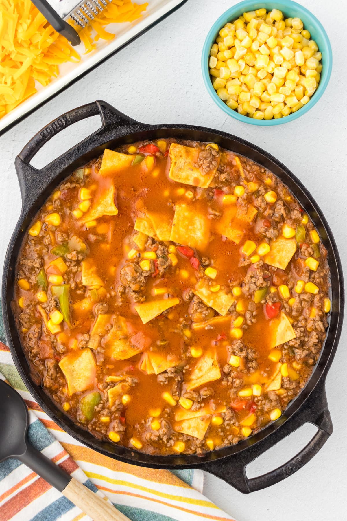 The beef tamale mixture simmering in the skillet.