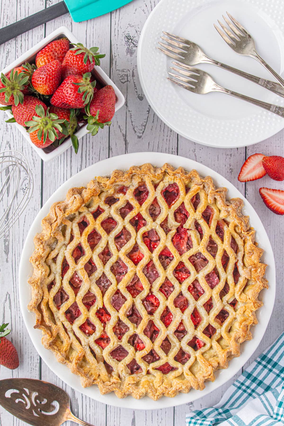 Overhead view of the lattice top of the finished strawberyr rhubarb pie.