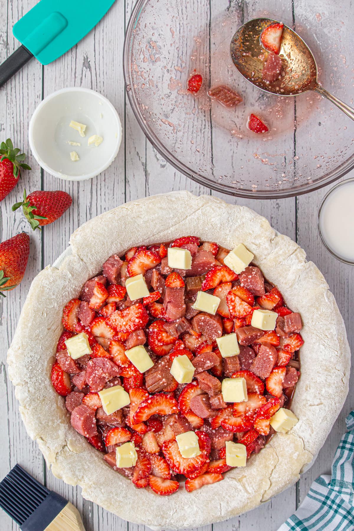 Fruit filling in the crust and dotted with butter.