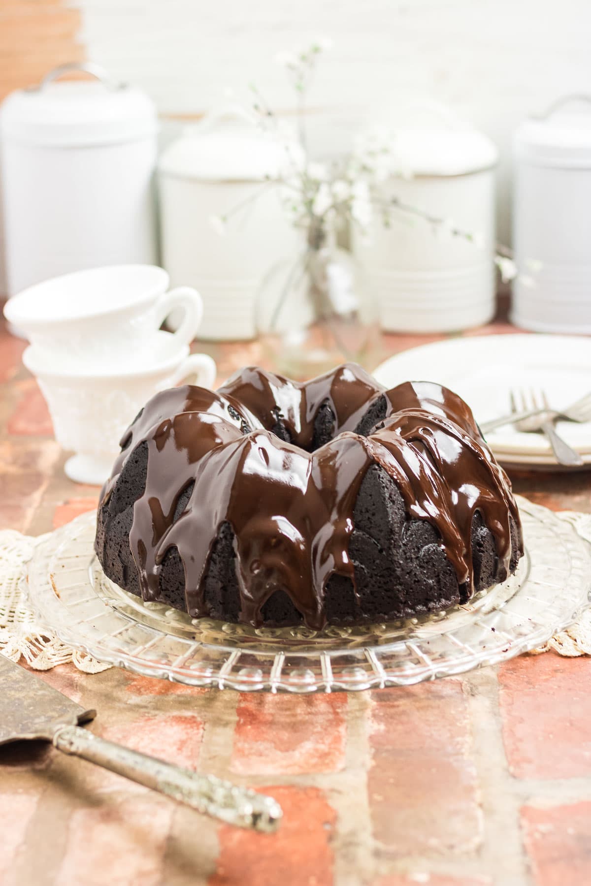 A chocolate bundt cake on a countertop.