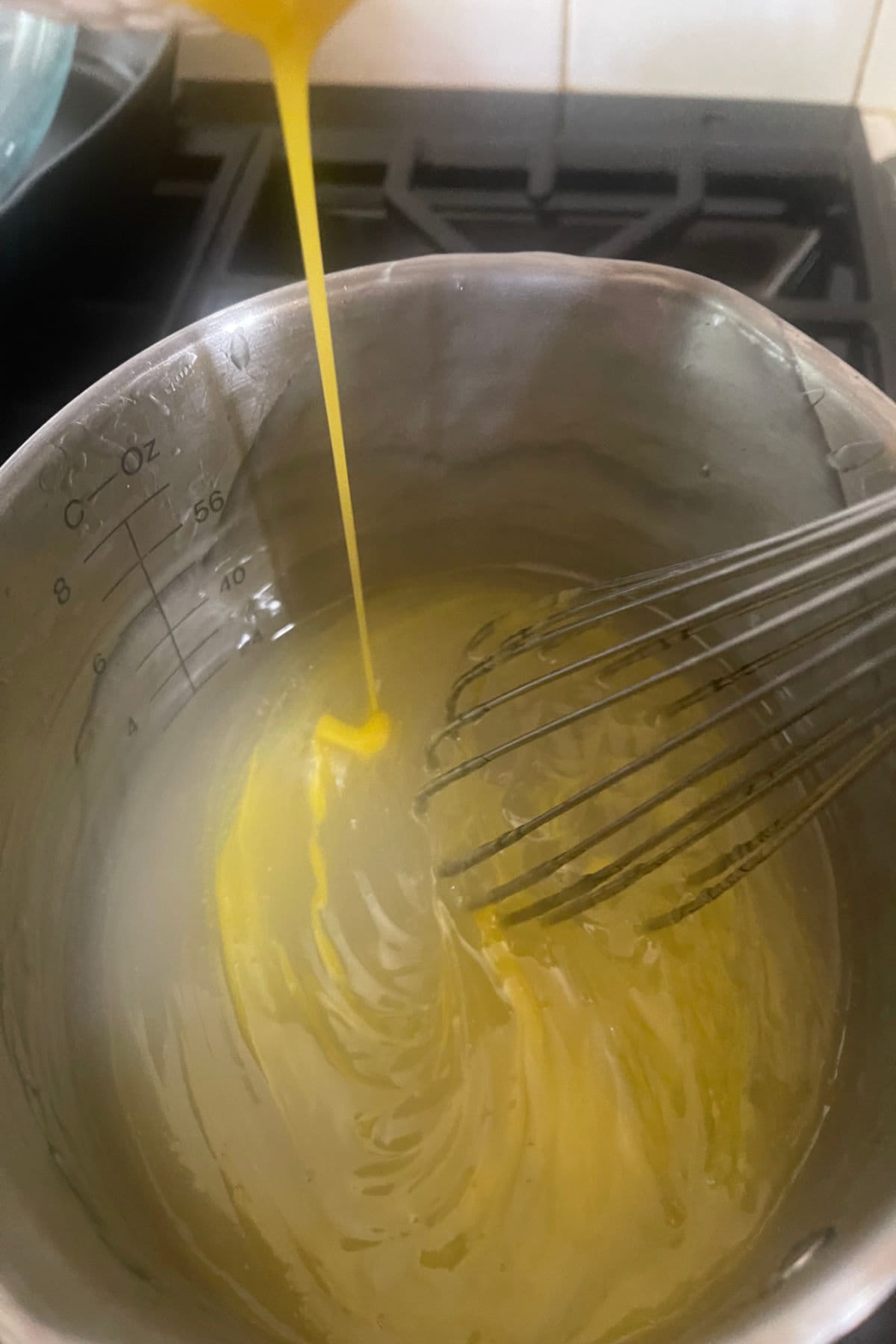 Egg yolks being added to cornstarch mixture.