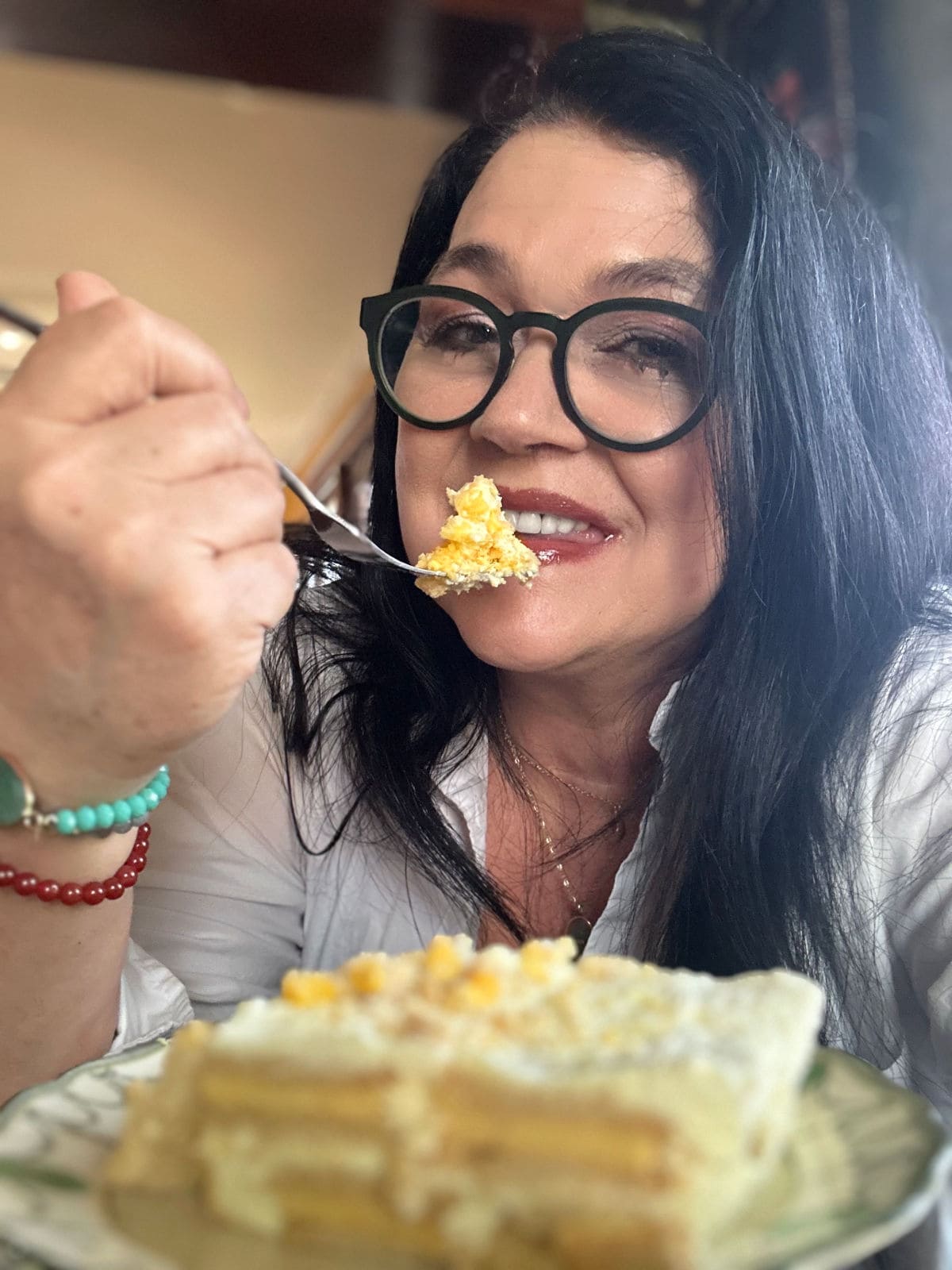 Marye Audet, founder of Restless Chipotle Media, eating a rich lemon icebox cake.