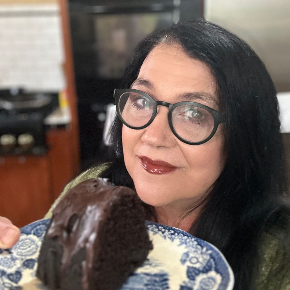 Marye Audet, Founder of Restless Chipotle, with a slice of dark chocolate bundt cake.