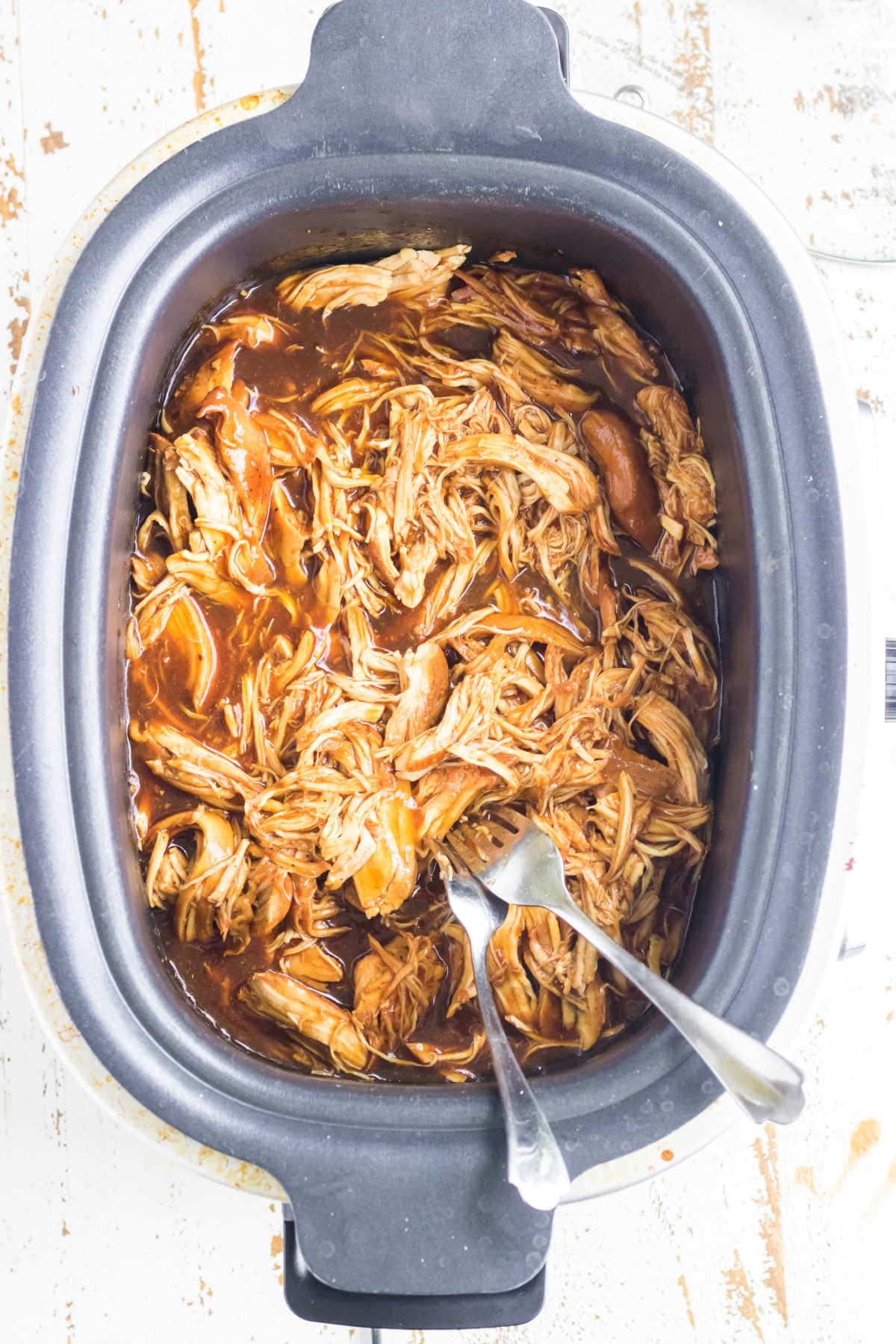 Shredded chicken in slow cooker.