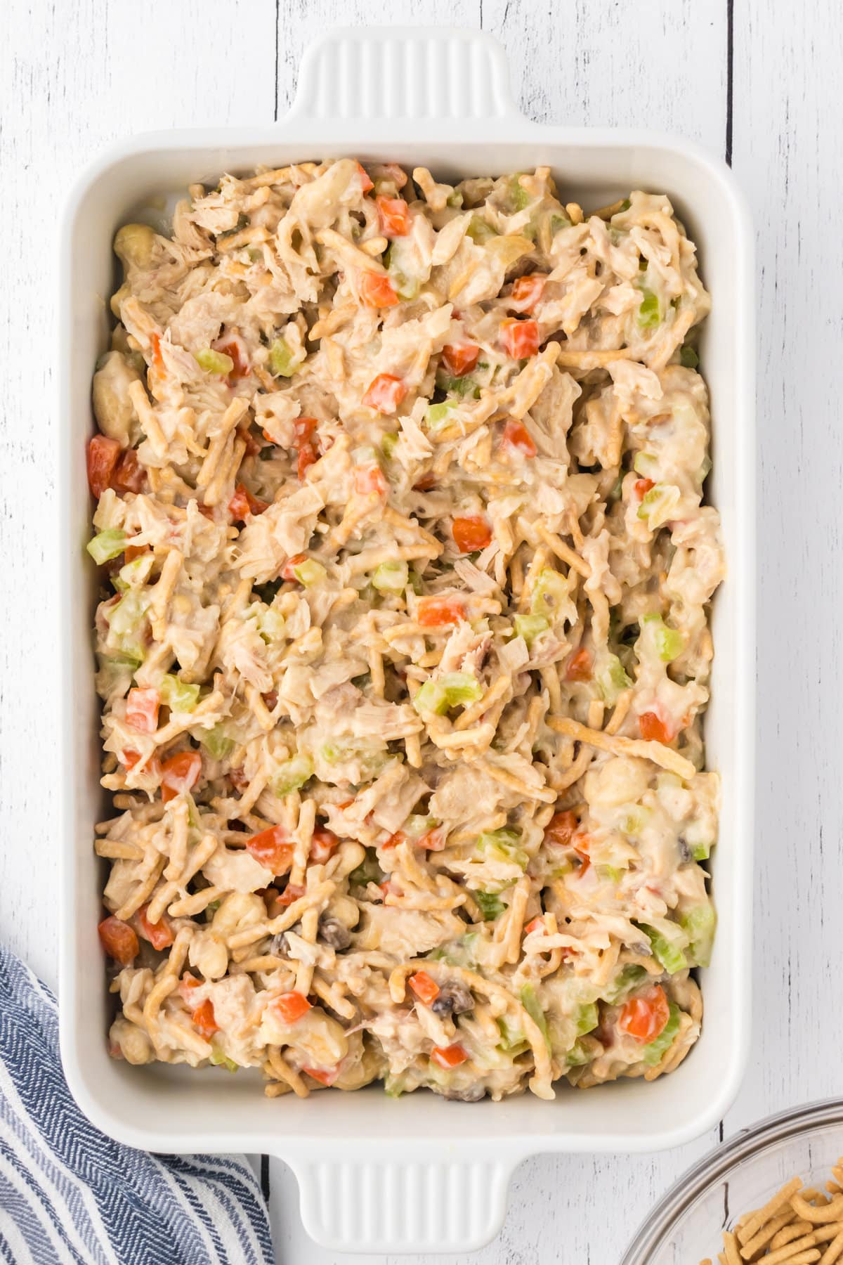 The tuna casserole mixture spread in a baking dish.