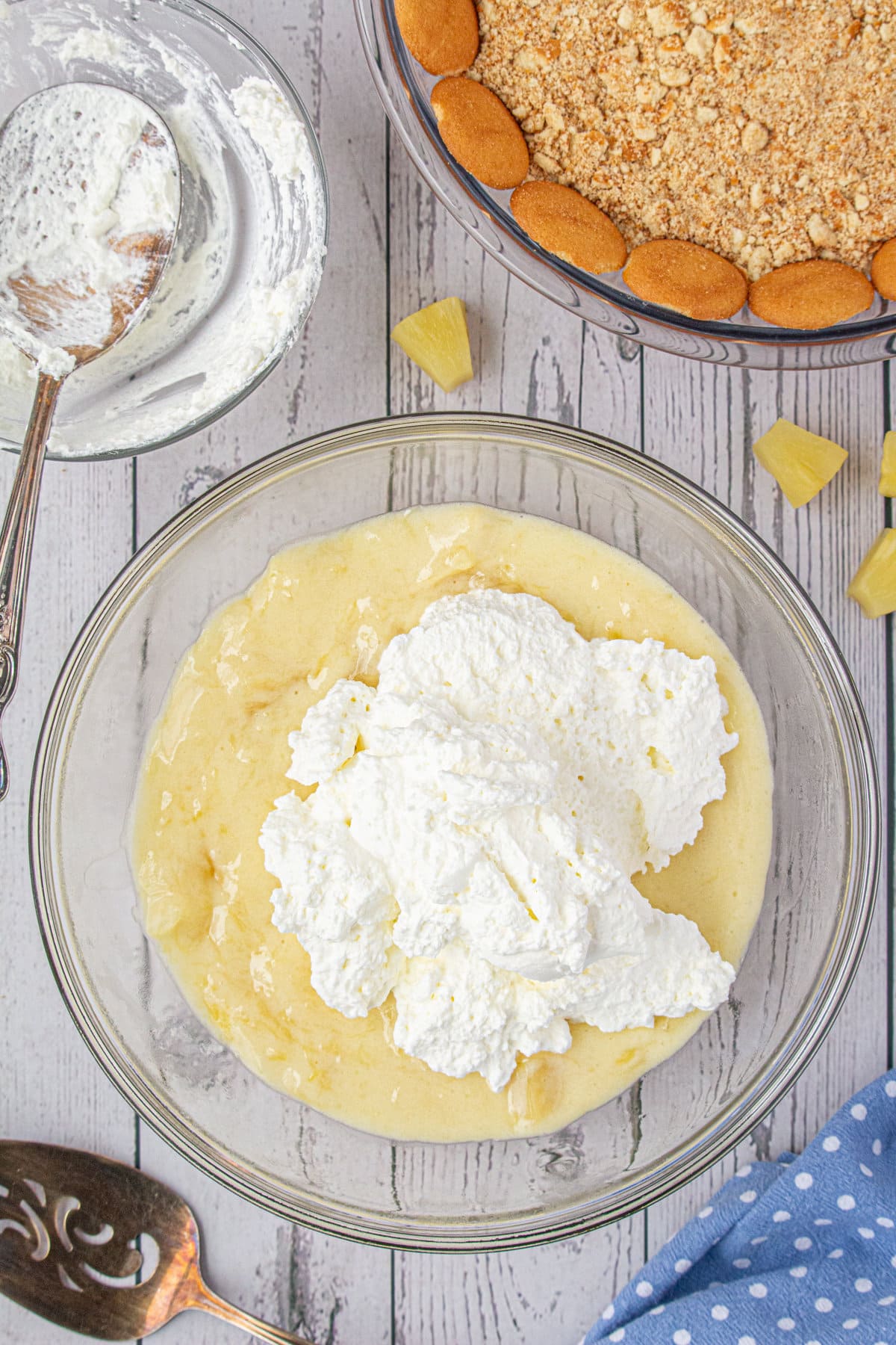 Folding whipped cream into the pie filling.