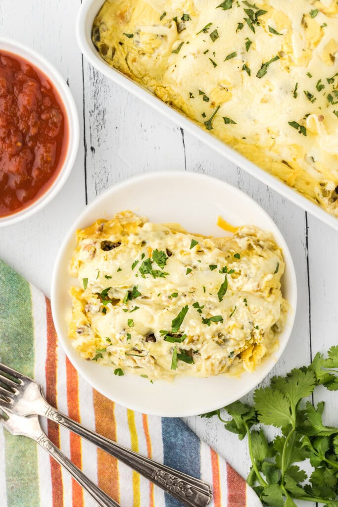 Green chile enchiladas on a plate.