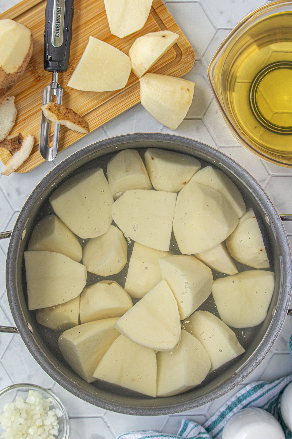 Parboiling the potatoes for tater tots.