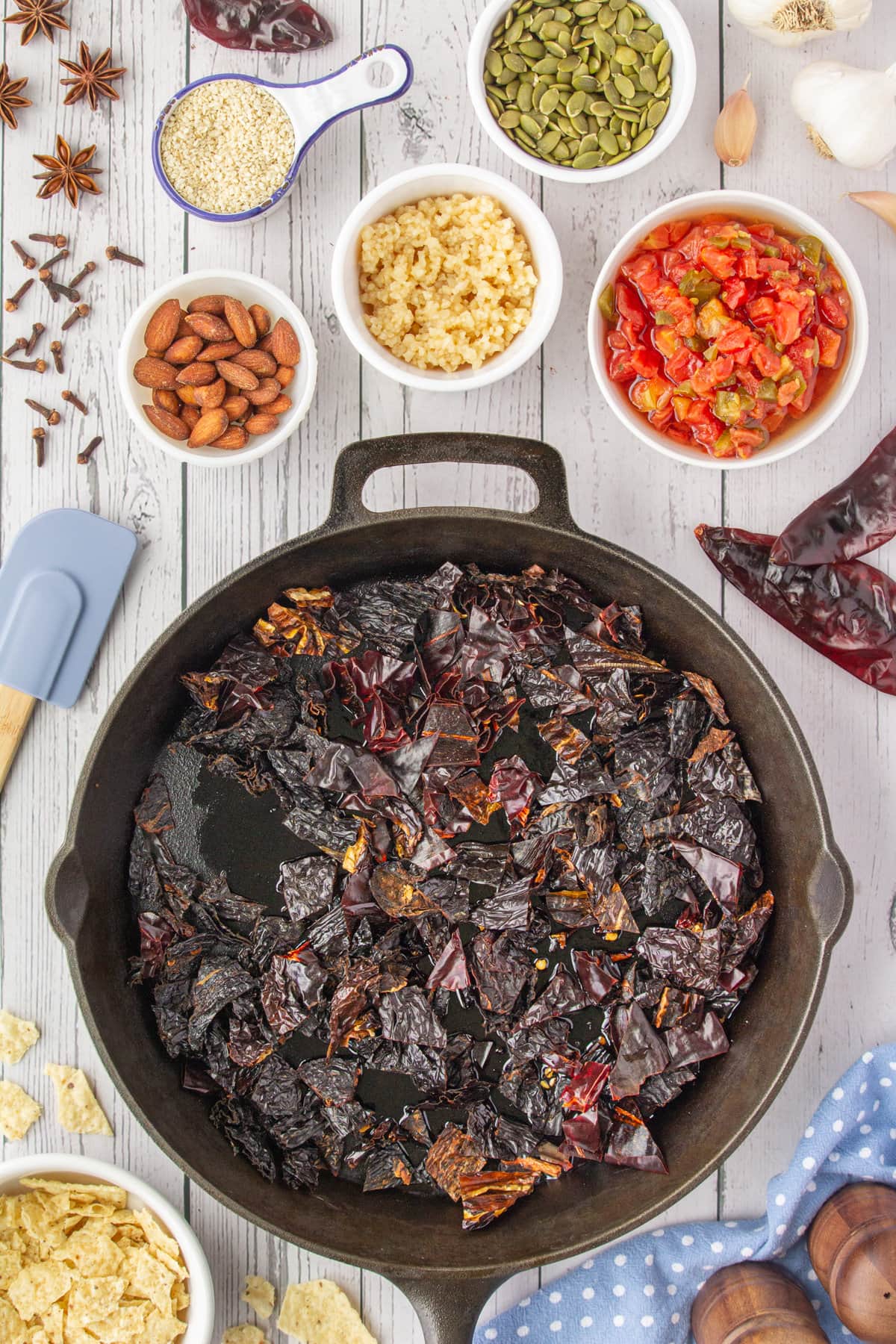 Dried chiles in a skillet.