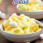 Two serving bowls of orange cream salad with title text overlay for Pinterest.