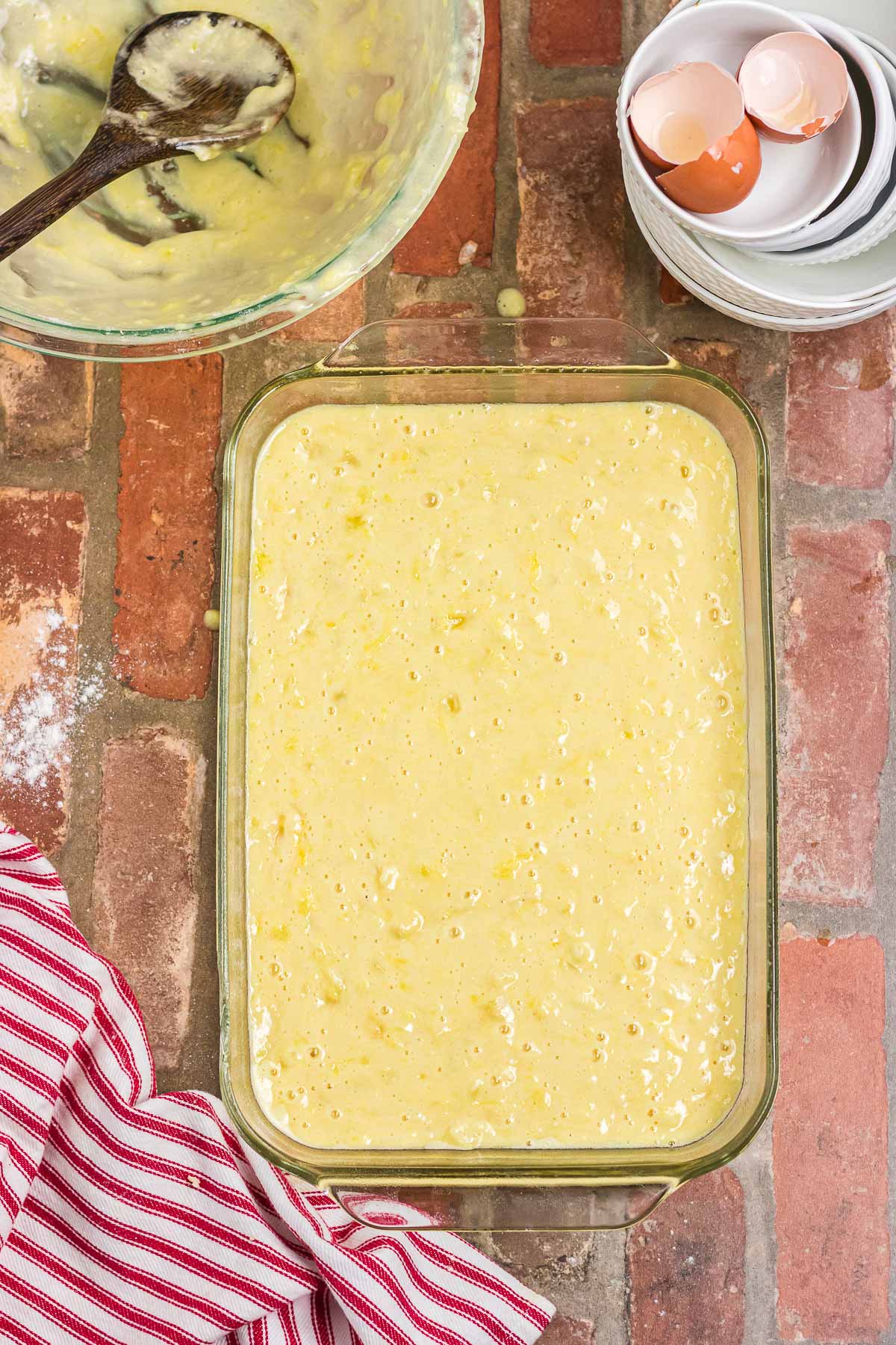 The cake batter poured into a baking dish.