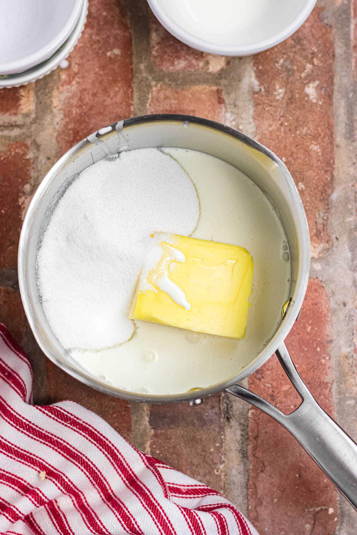 The butter, cream, and sugar in a saucepan.
