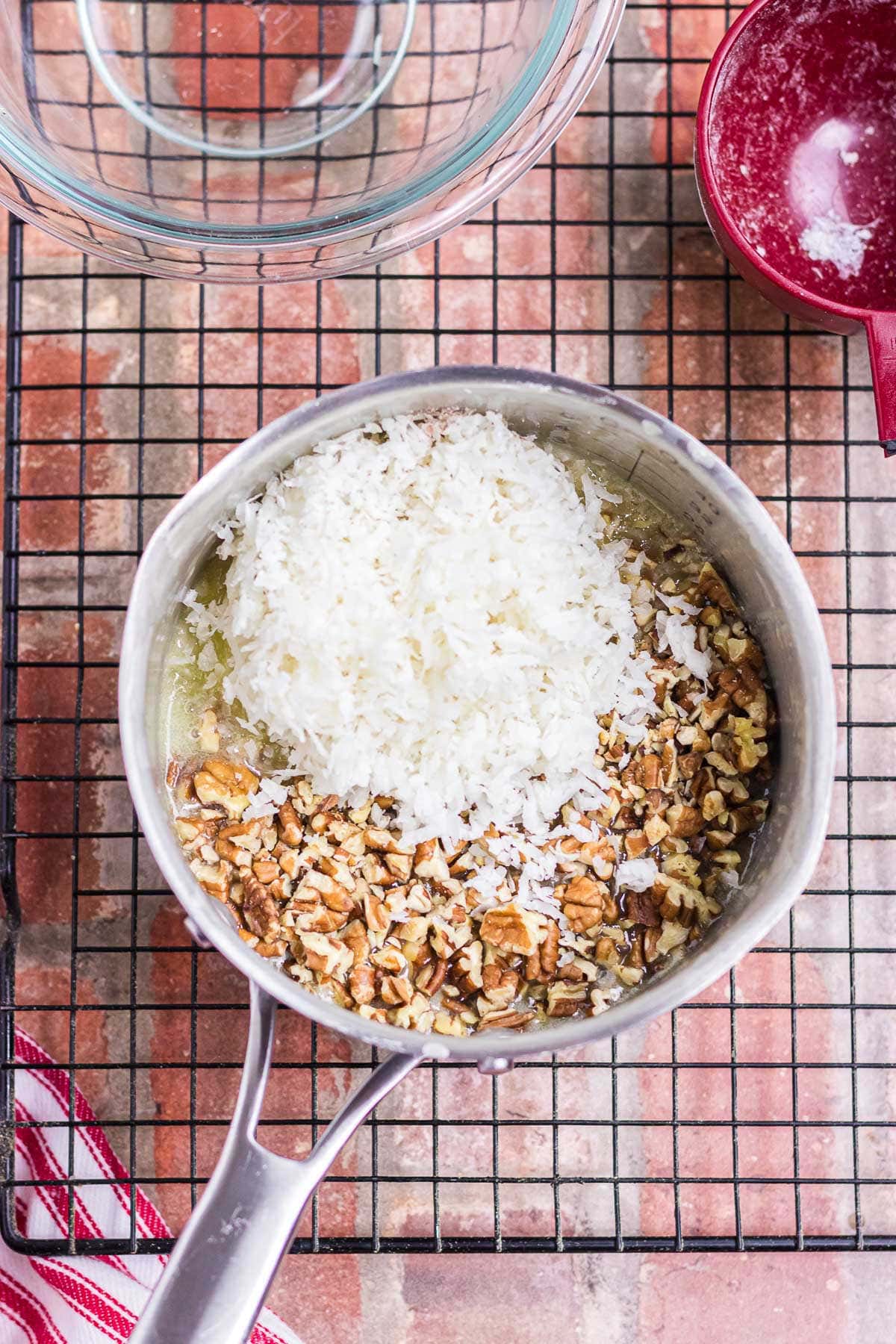 Coconut and pecans are added to the simmered cream mixture.