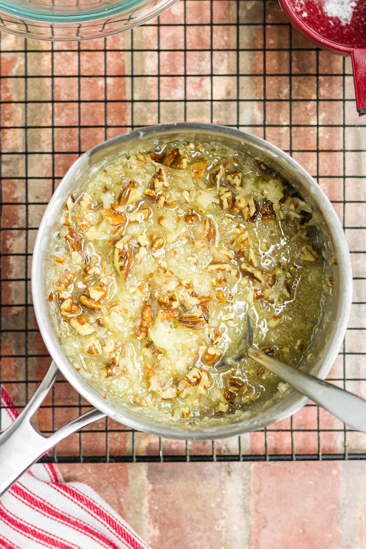 Coconut and pecans mixed into the frosting mixture.