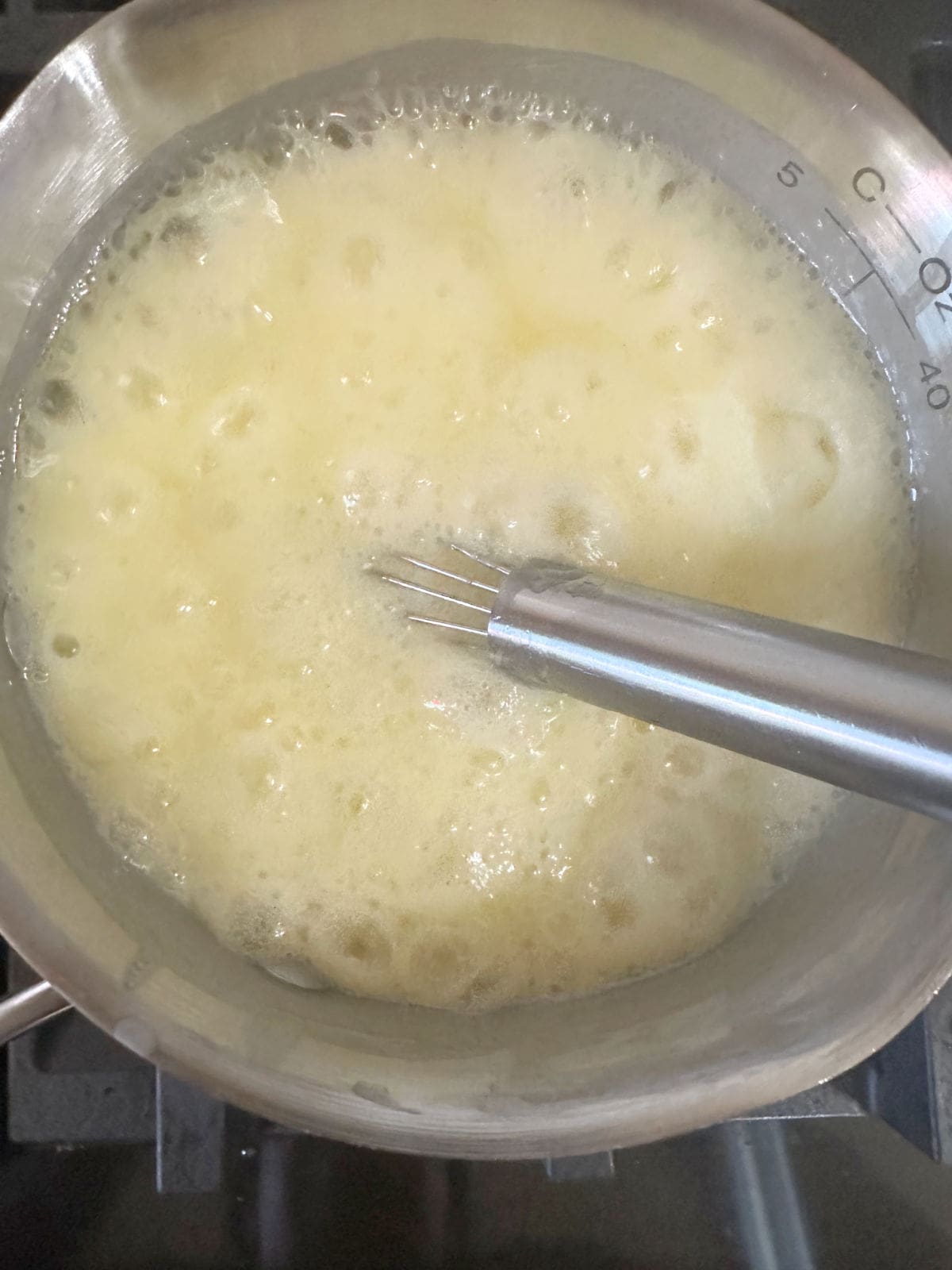 The butter mixture simmering in the saucepan.