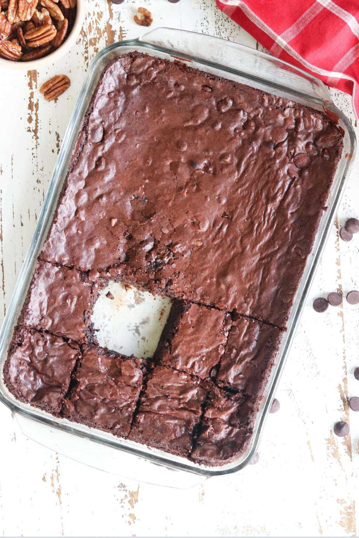 Overhead view of brownies with one cut out of it.