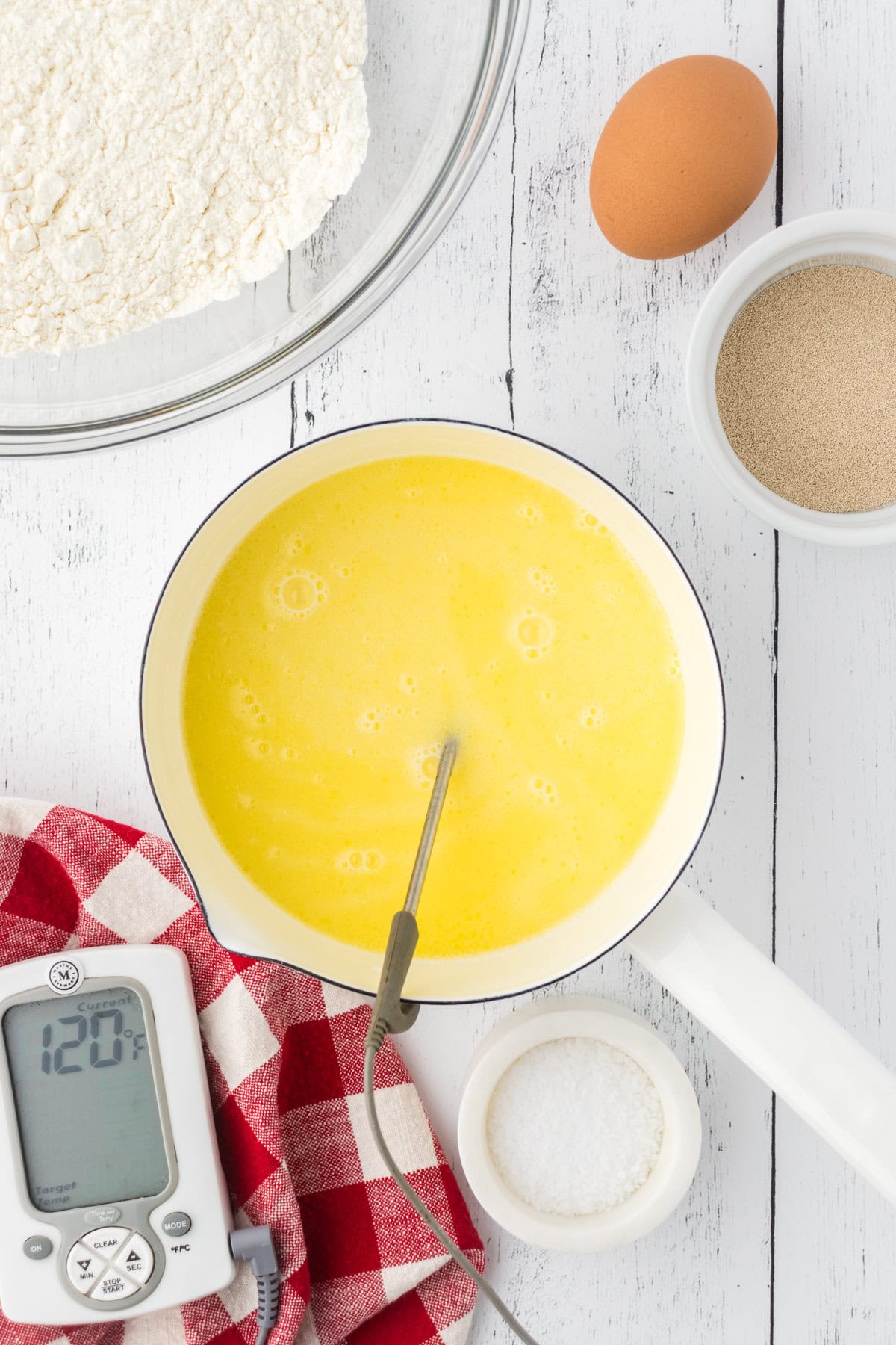 Milk, honey, and butter heated up in a pan.