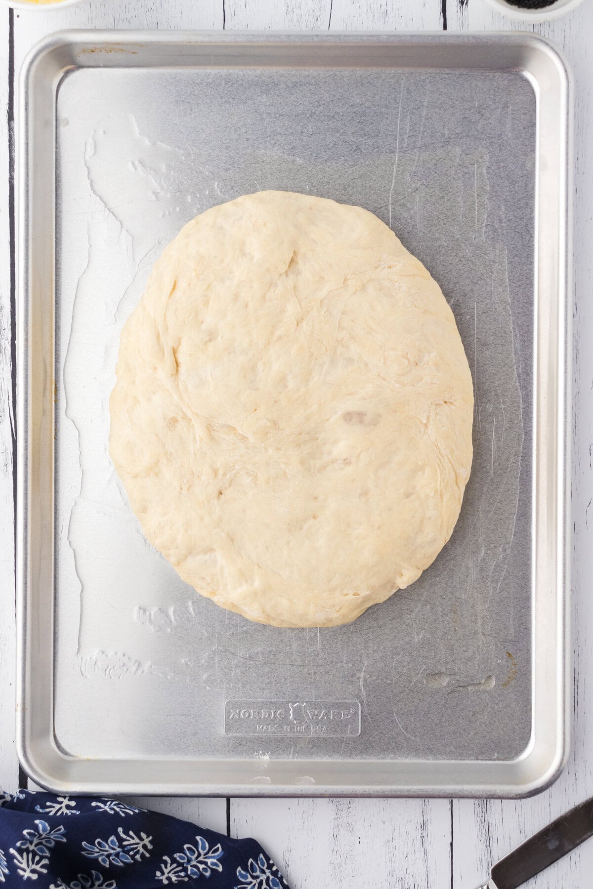 The oval dough on an oiled cookie sheet.