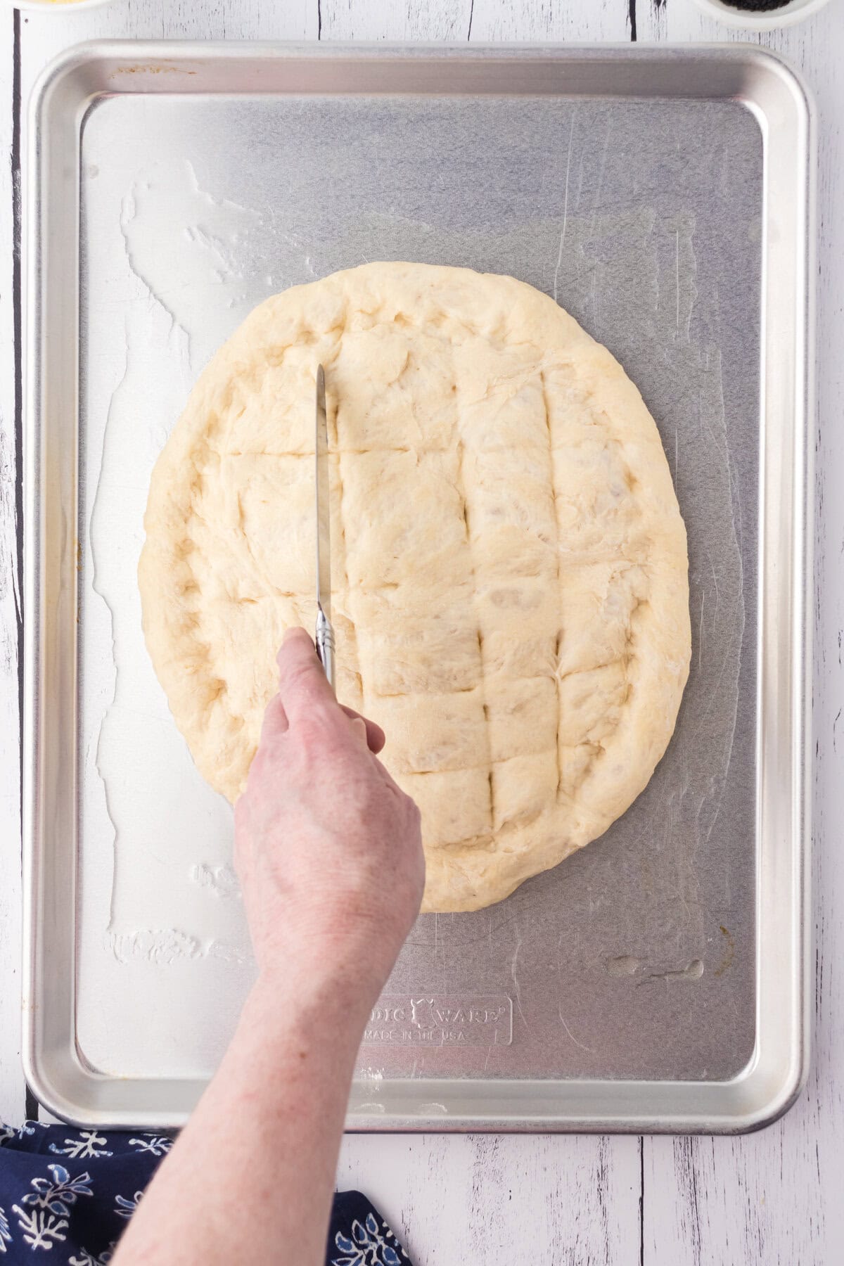 Here the pattern is being added with a butter knife.