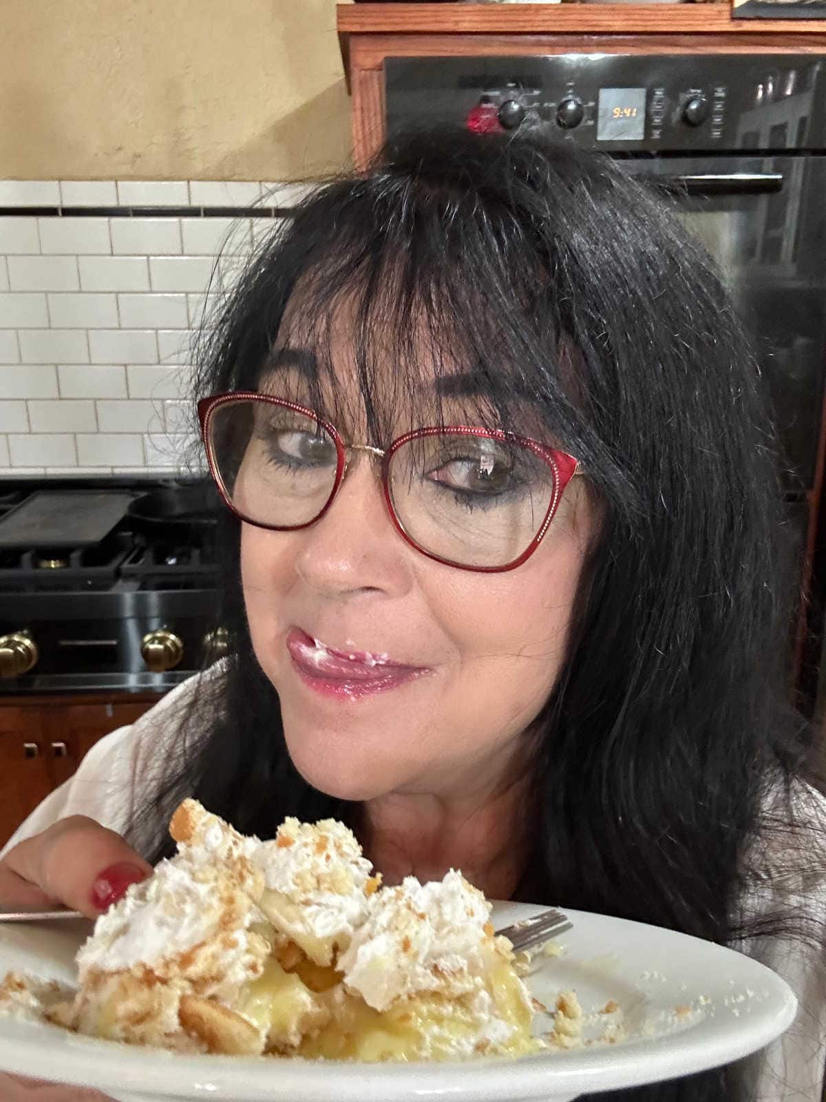 Marye Audet enjoying this banana pudding poke cake.