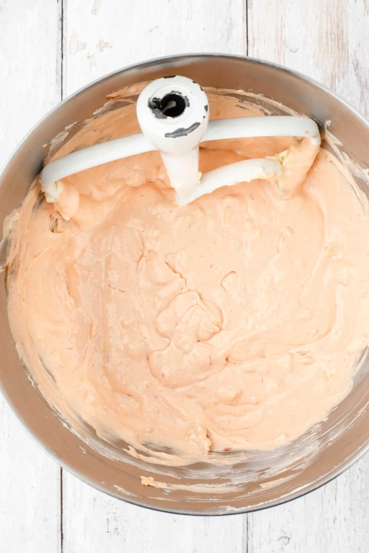 Mixing bowl with cream cheese blended with salsa.