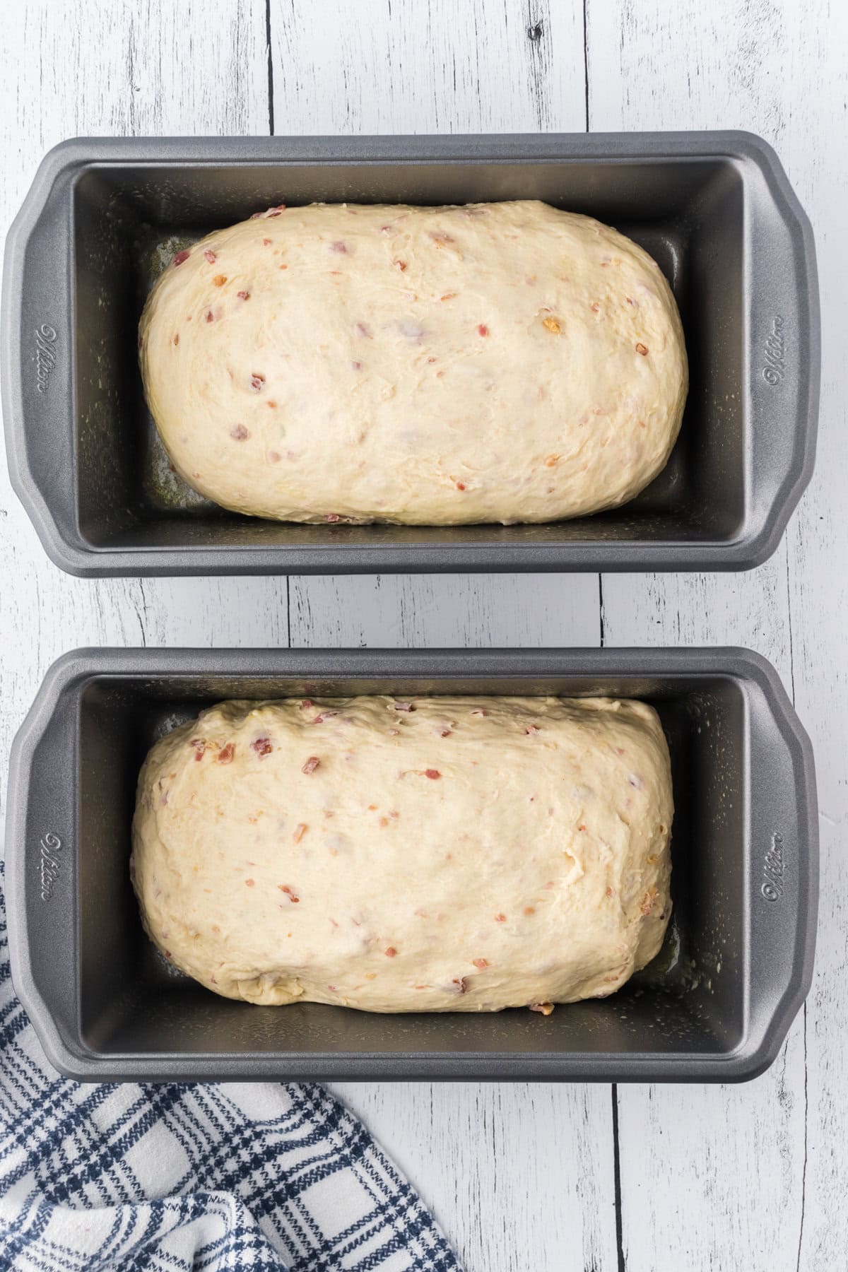Shaped dough in bread pans.