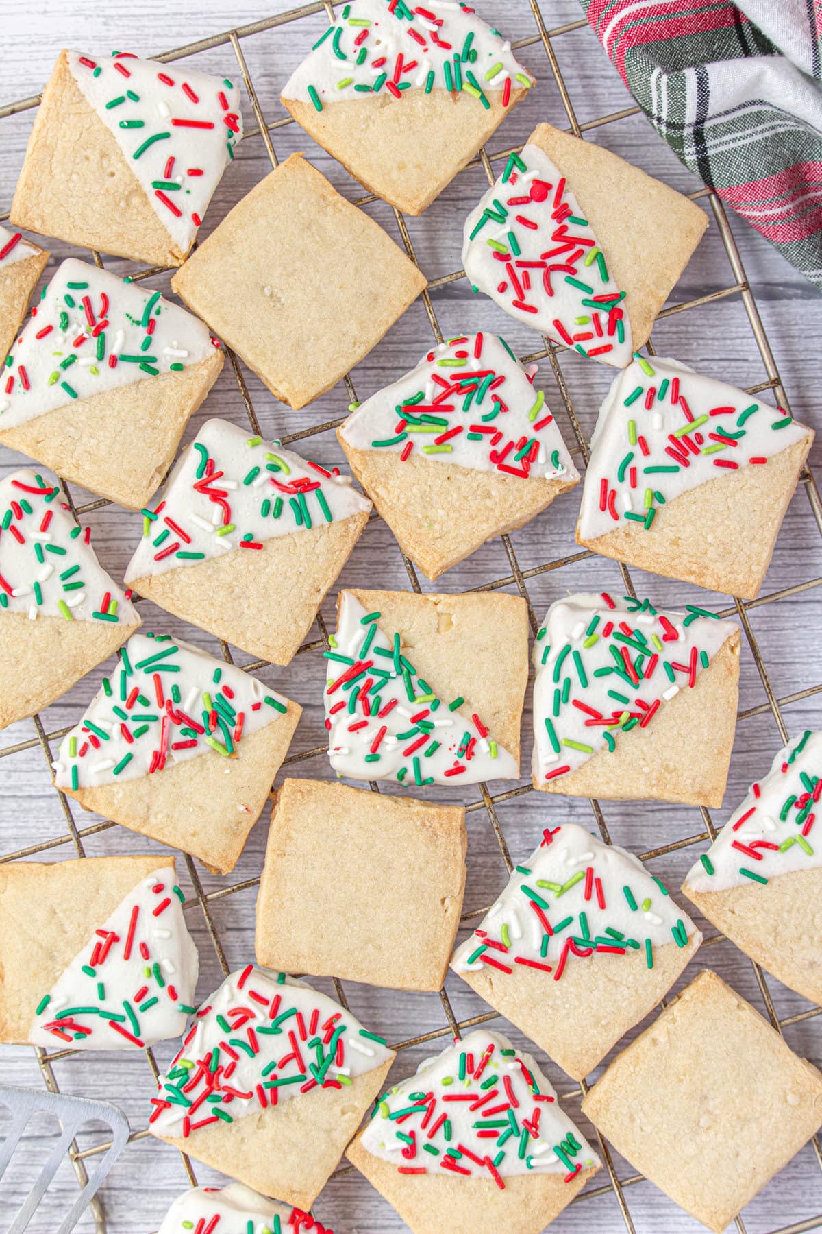 Christmas Hawaiian shortbread cookies on a cooling rack.