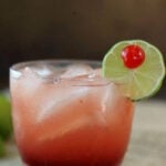 A cocktail on a dark background with title text overlay for Pinterest.