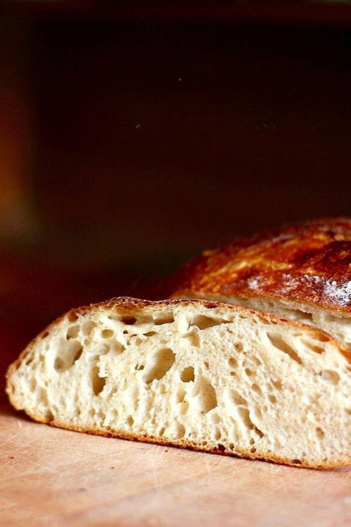 Closeup of sliced sourdough bread showing the texture inside.