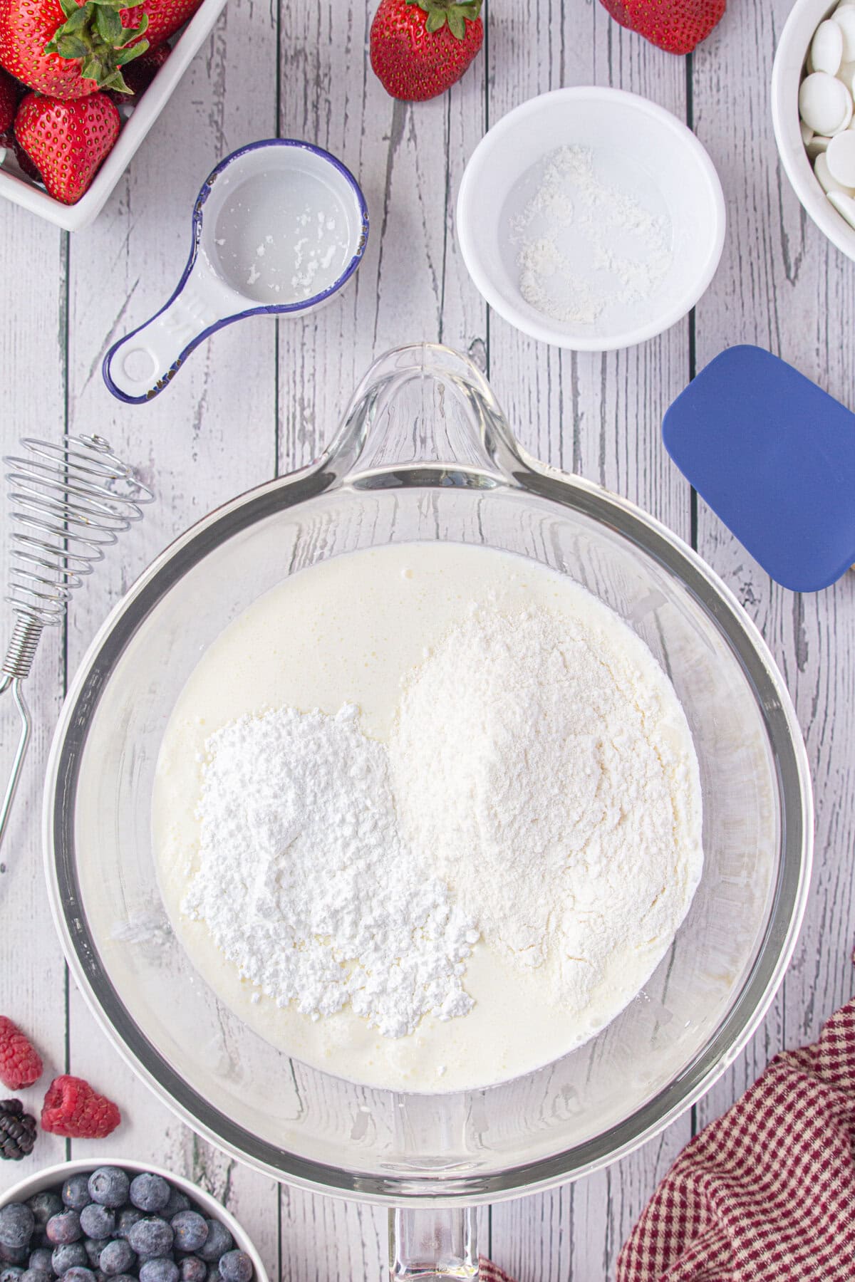 The ingredients for the frosting in a mixing bowl.