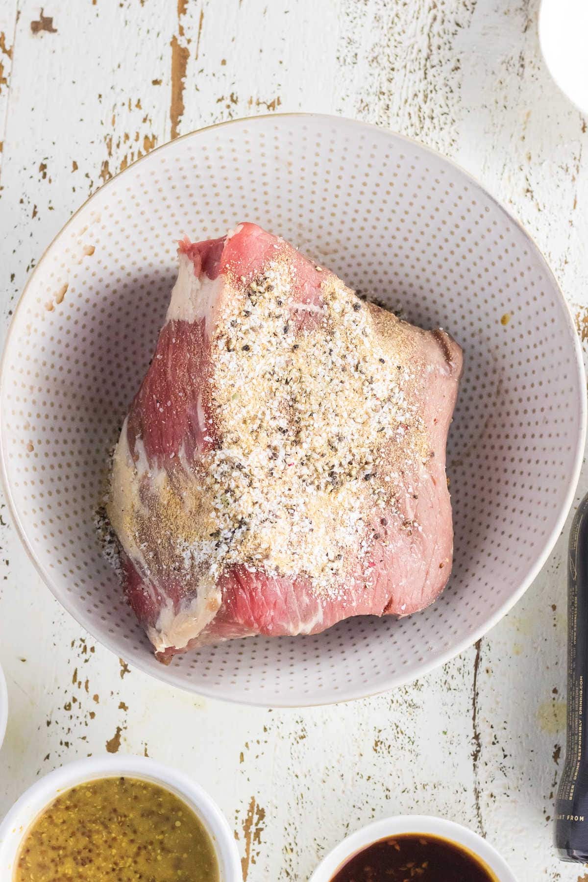 Bottom round roast rubbed with spices.