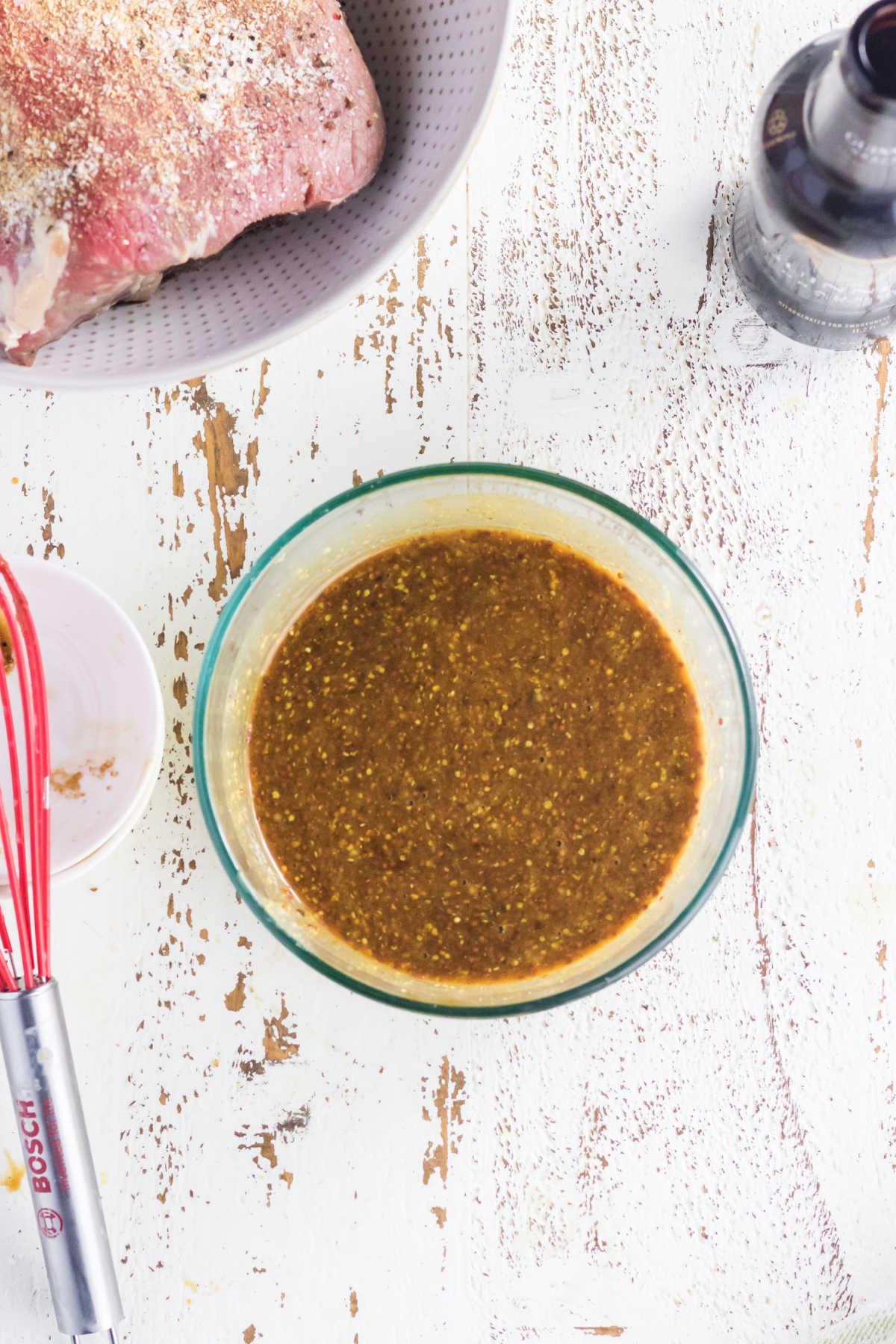 Sugar, mustard, and teriyaki sauce combined in a bowl.