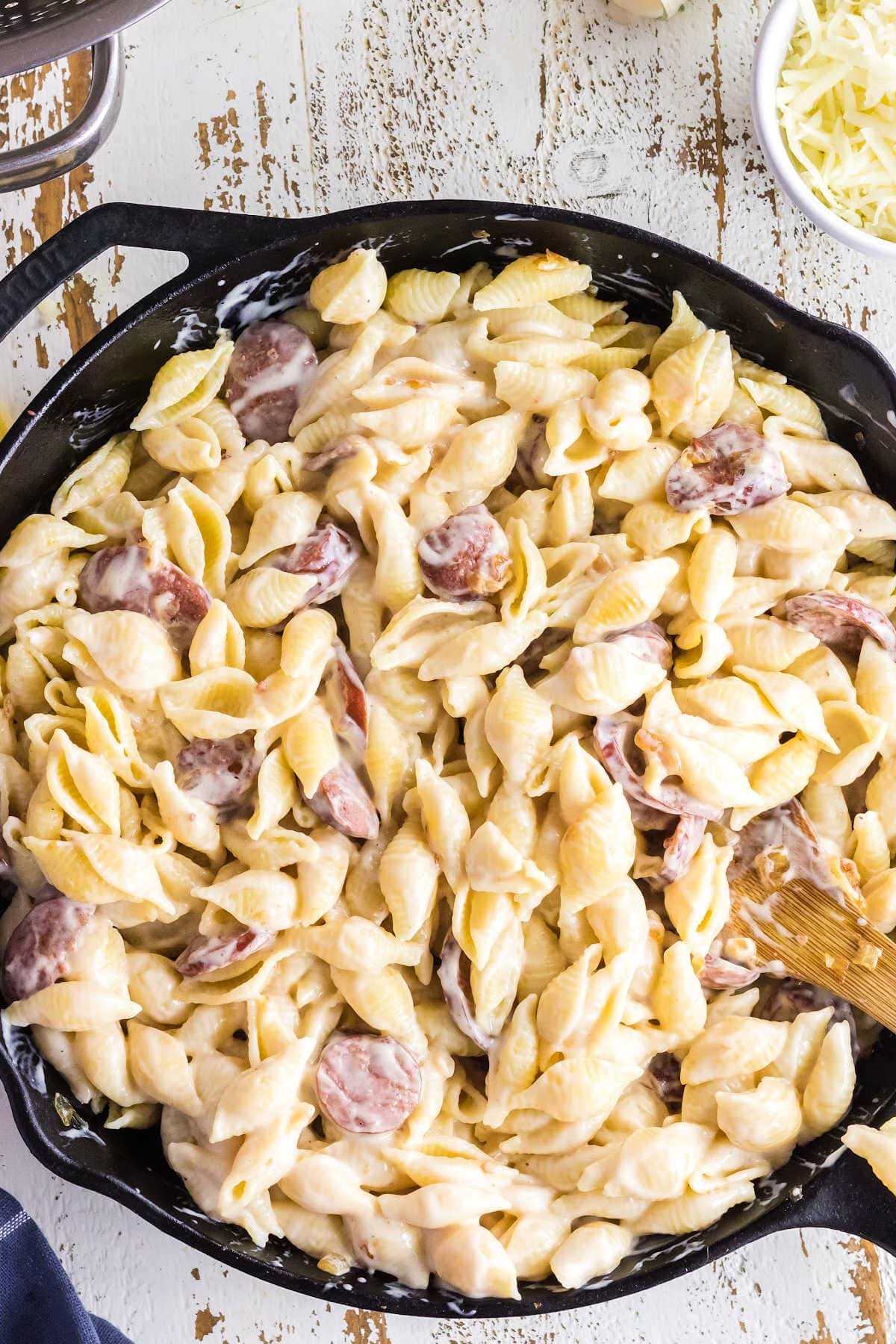 Ingredients are stirred together and covered in the sauce.